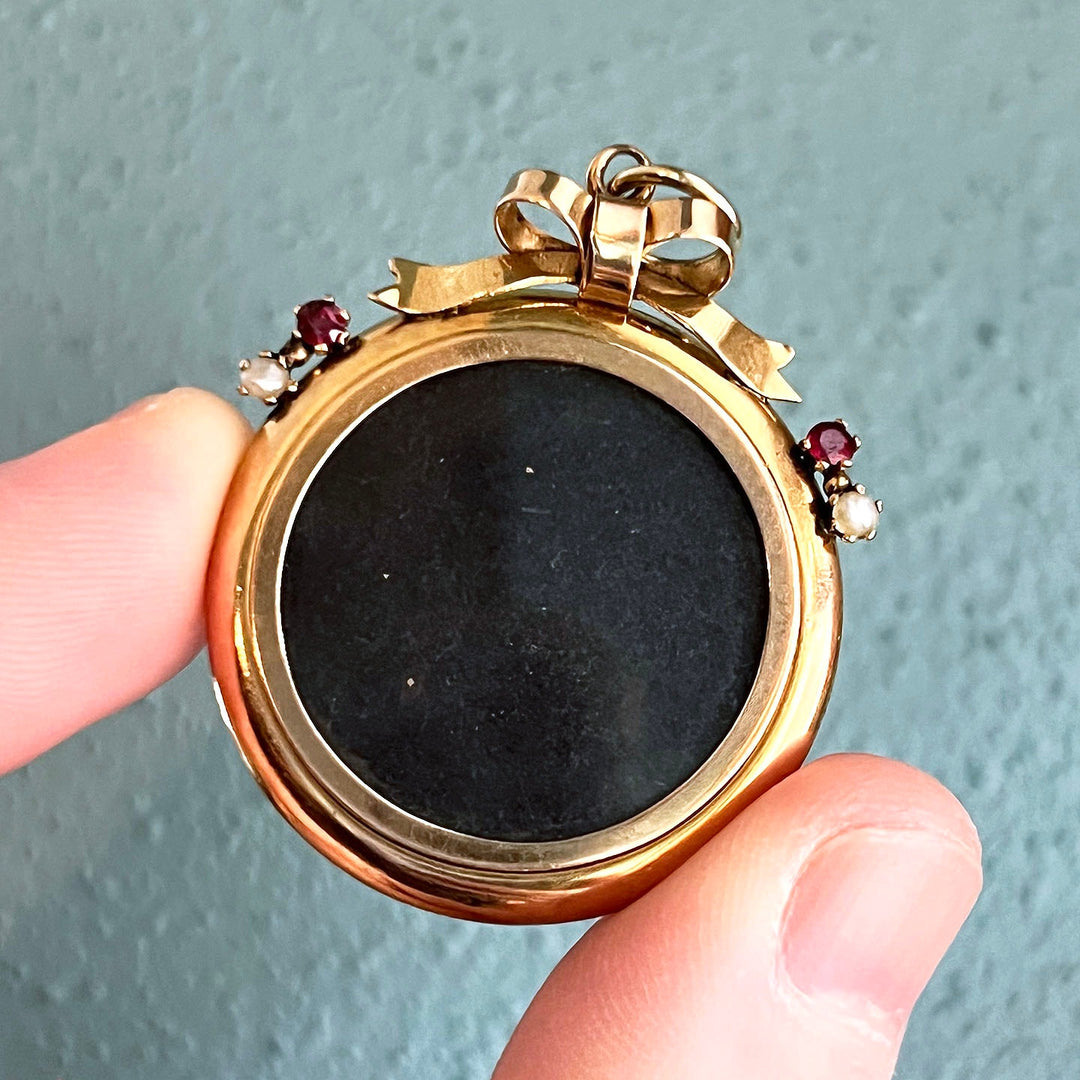 Antique Victorian 9 karat gold ruby pearl locket