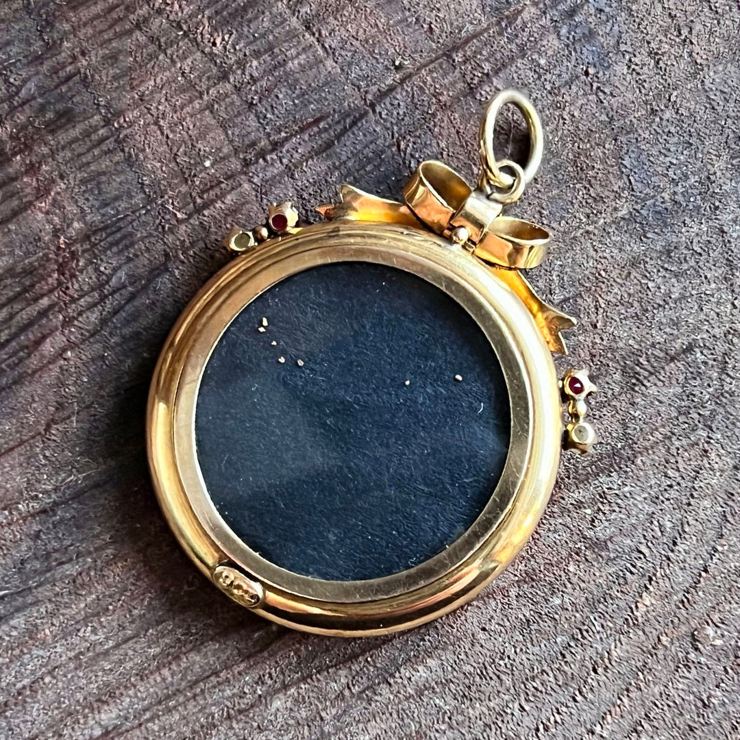 Close view of ruby accented gold locket