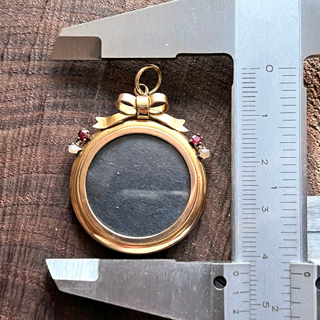 Antique gold locket with ruby detail
