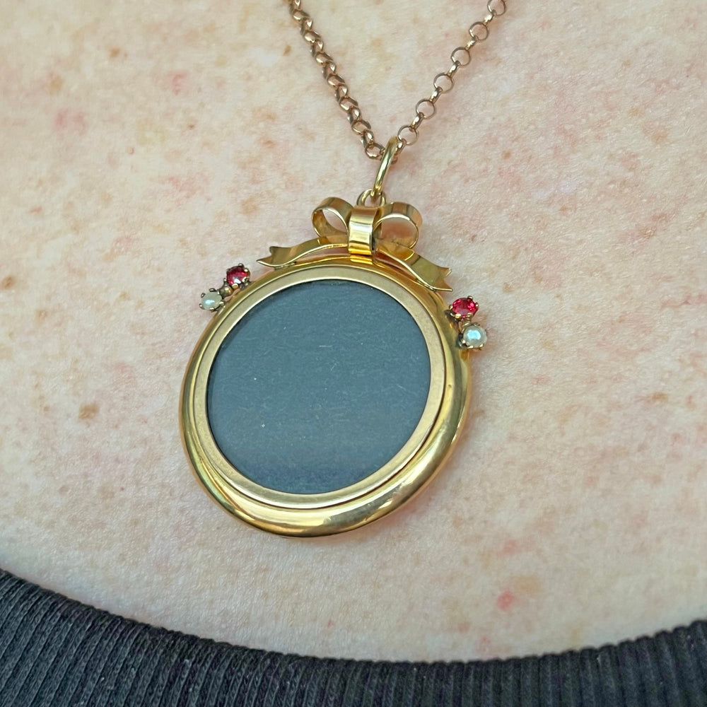 Antique Victorian 9 karat gold ruby pearl locket