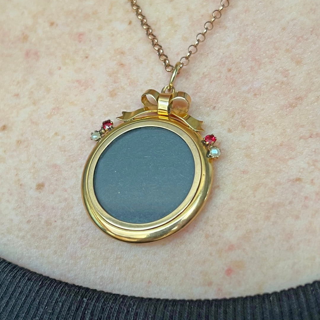 Antique Victorian 9 karat gold ruby pearl locket