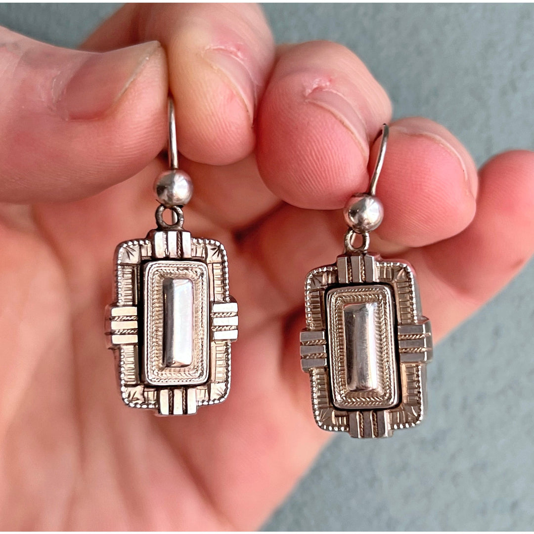 Victorian silver earrings with flowing design