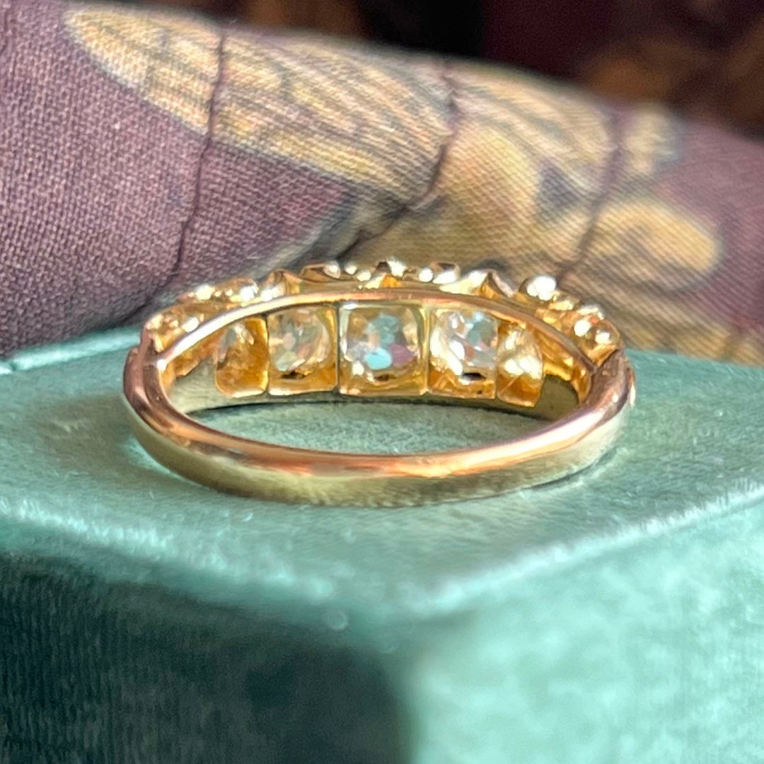 Close up antique diamond boat ring sparkling old cut stones