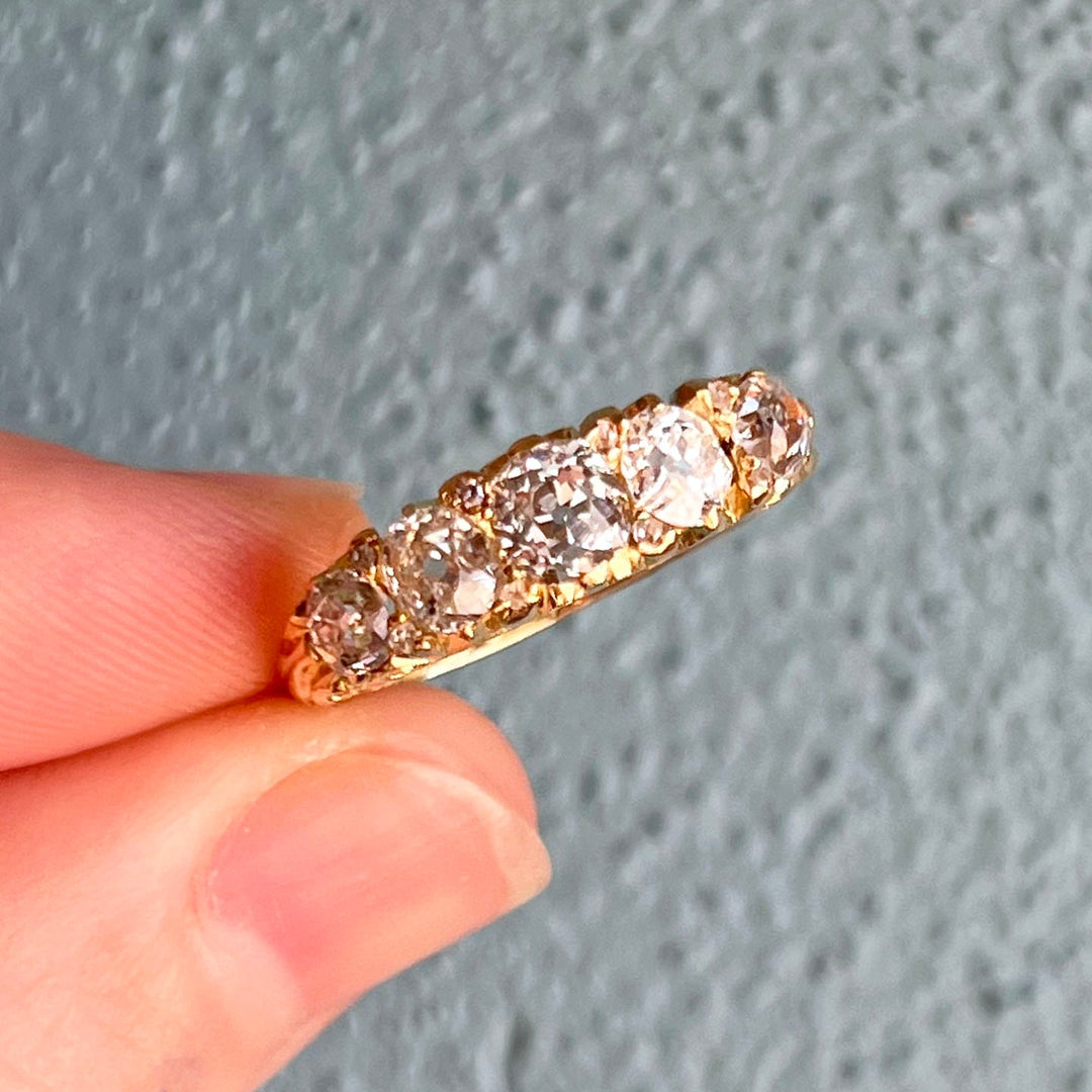 Close up antique diamond boat ring sparkling old cut stones