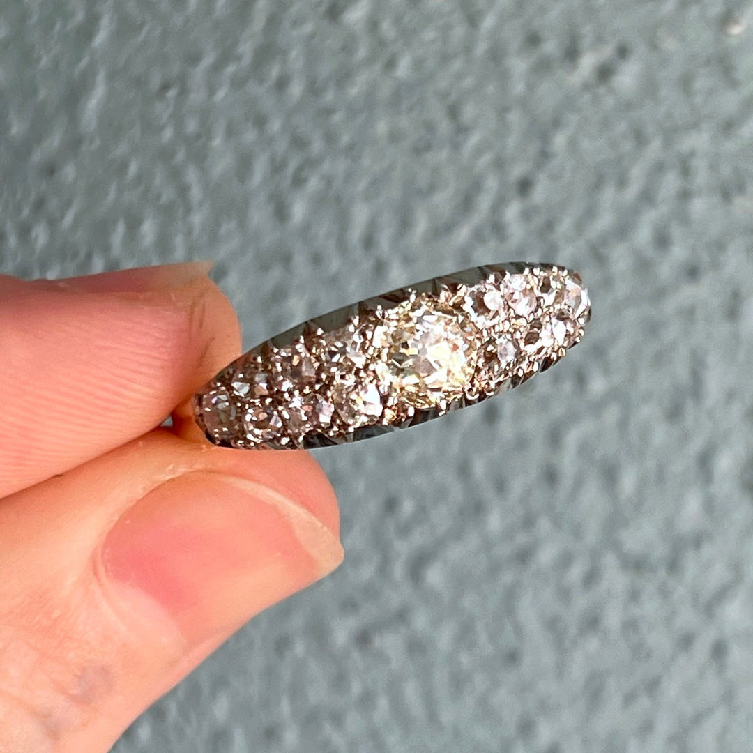 Close up antique diamond boat ring sparkling old cut stones