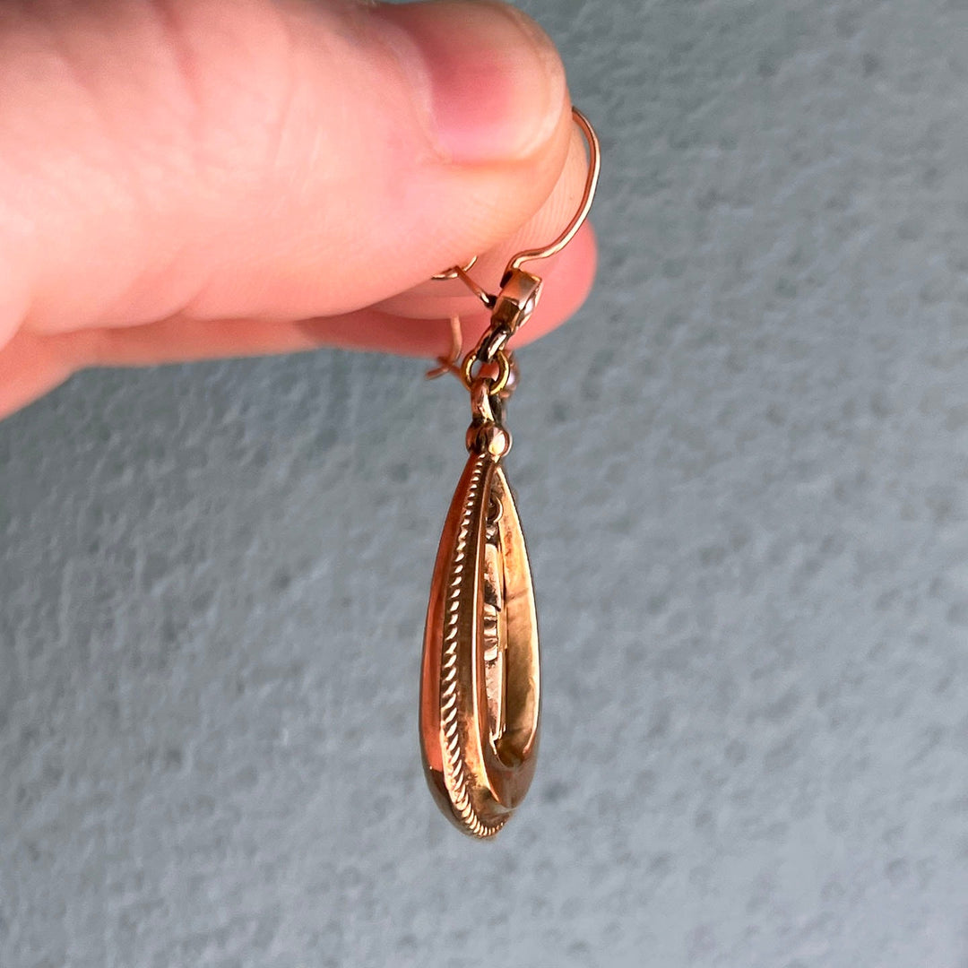 Side profile of Victorian cross drop earrings