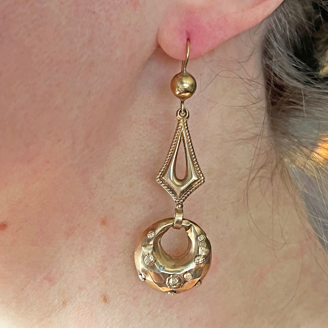 Victorian gold earrings worn on ear antique style