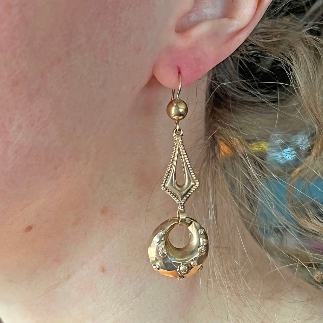 Victorian gold earrings worn on ear antique style