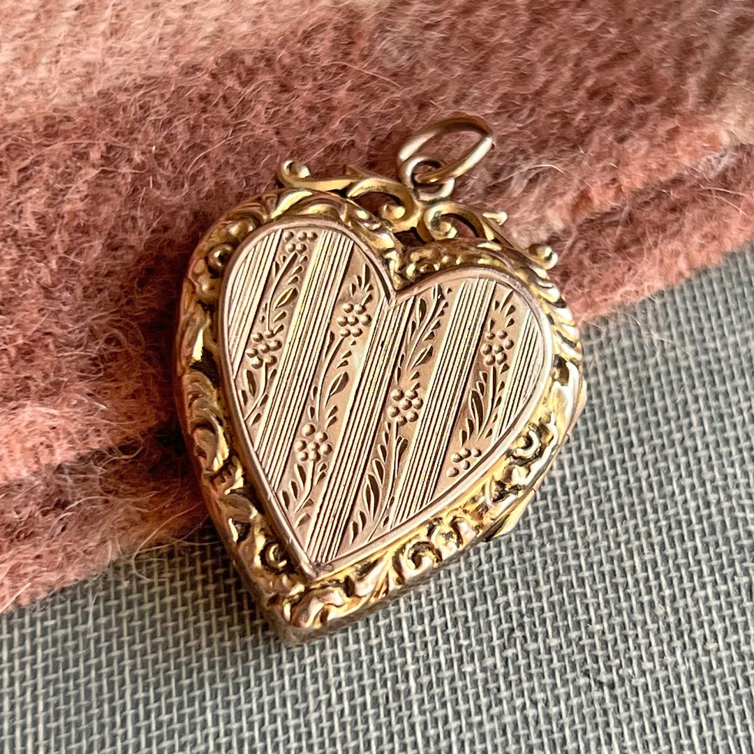 Detailed engraving on antique heart pendant