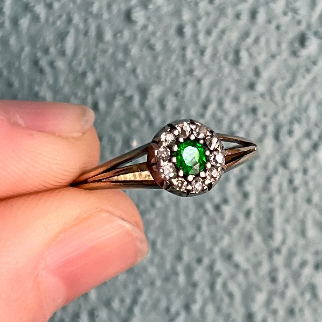 Detail of green garnet and diamond setting antique ring