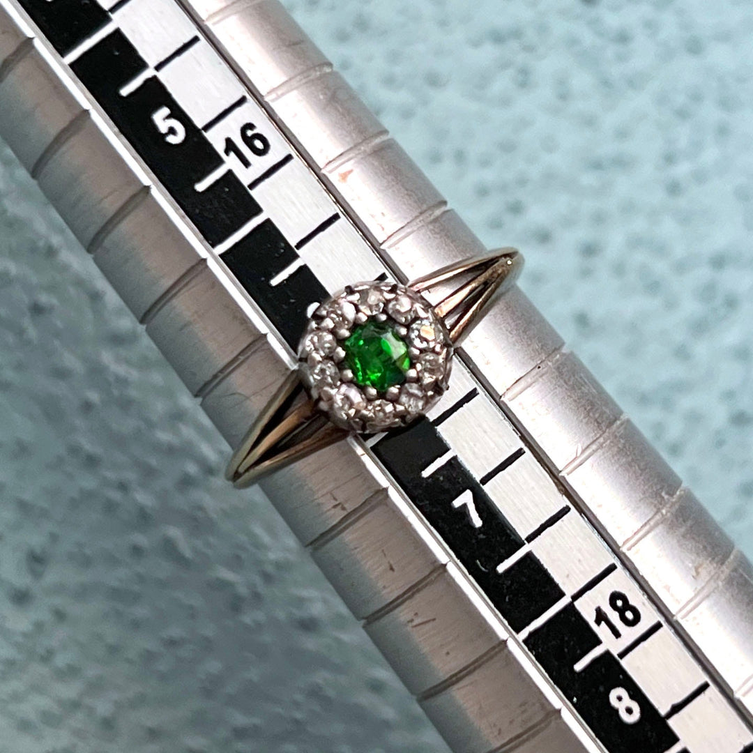 Detail of green garnet and diamond setting antique ring