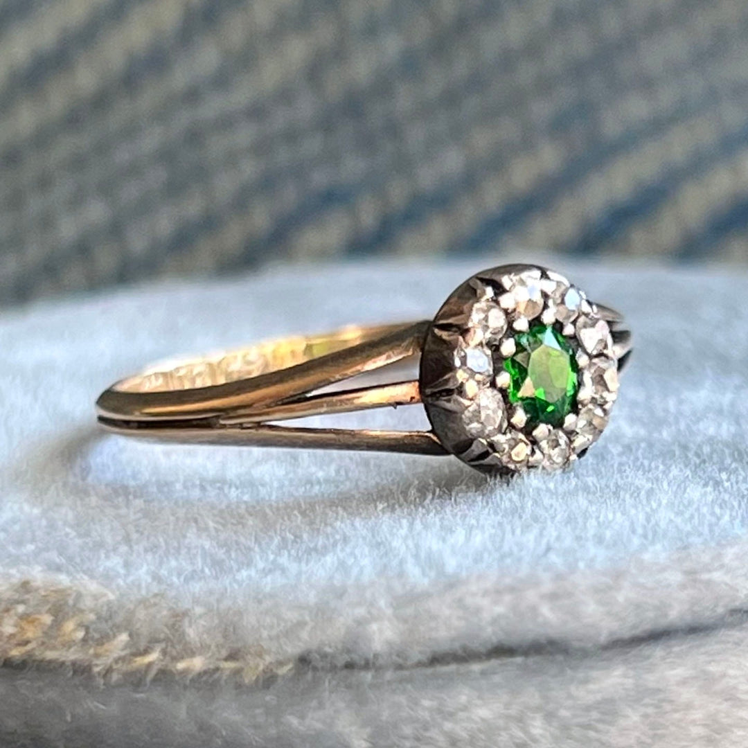 Close up green garnet gemstone antique diamond ring
