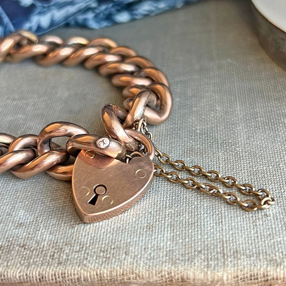 Close view of heart clasp curb link bracelet