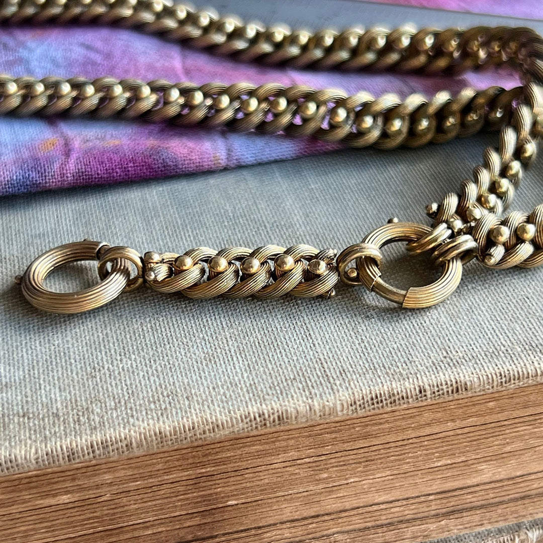 Close up antique gold link necklace detailed links