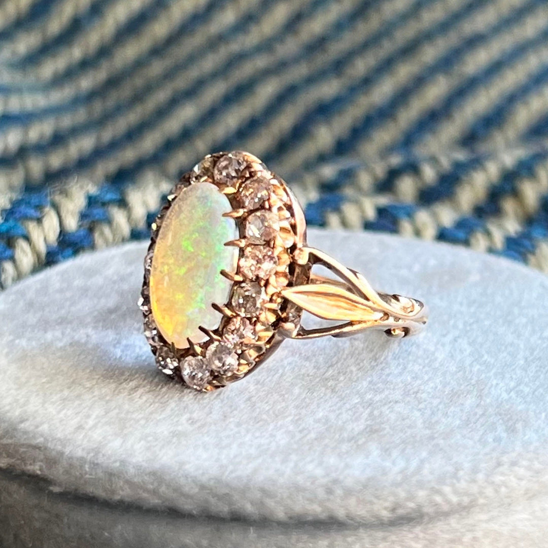 Side profile of opal diamond cluster ring