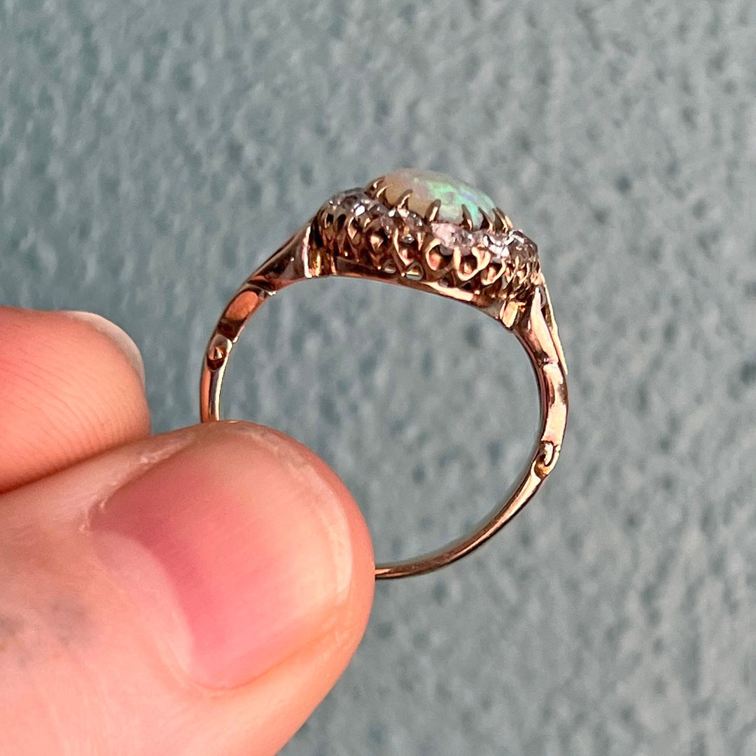 Side profile of opal diamond cluster ring