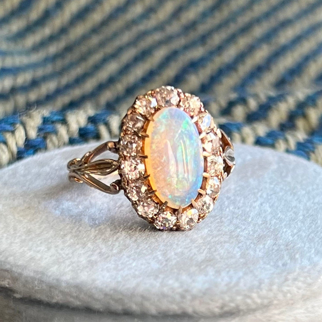 Side profile of opal diamond cluster ring