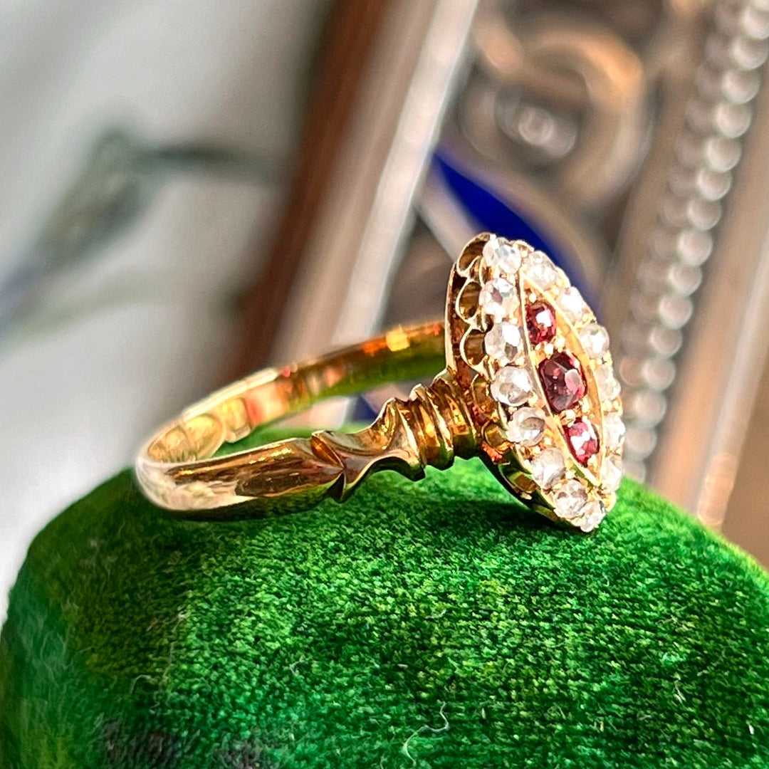 Close view of navette ruby diamond cluster ring