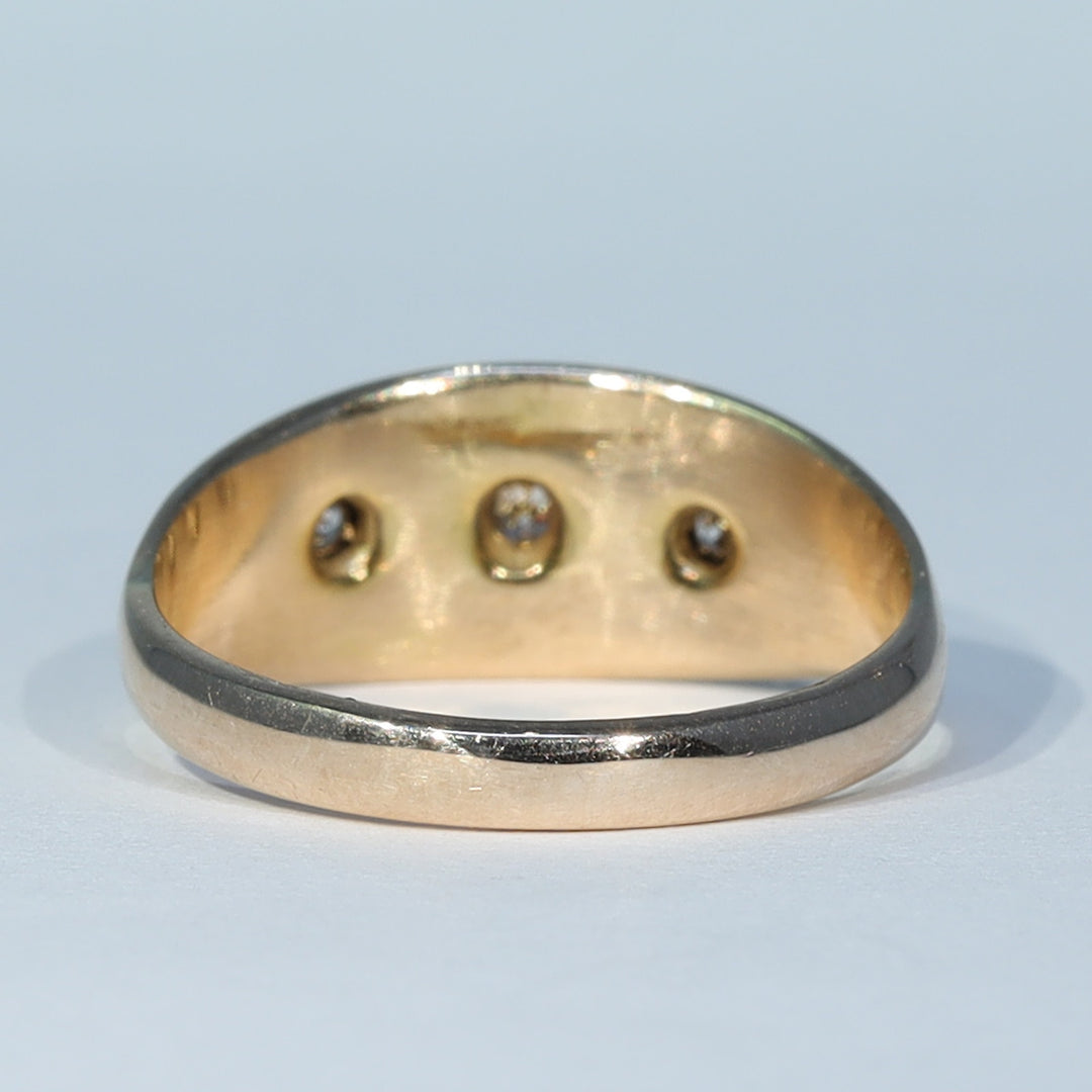 Antique trilogy ring with traditional diamond setting