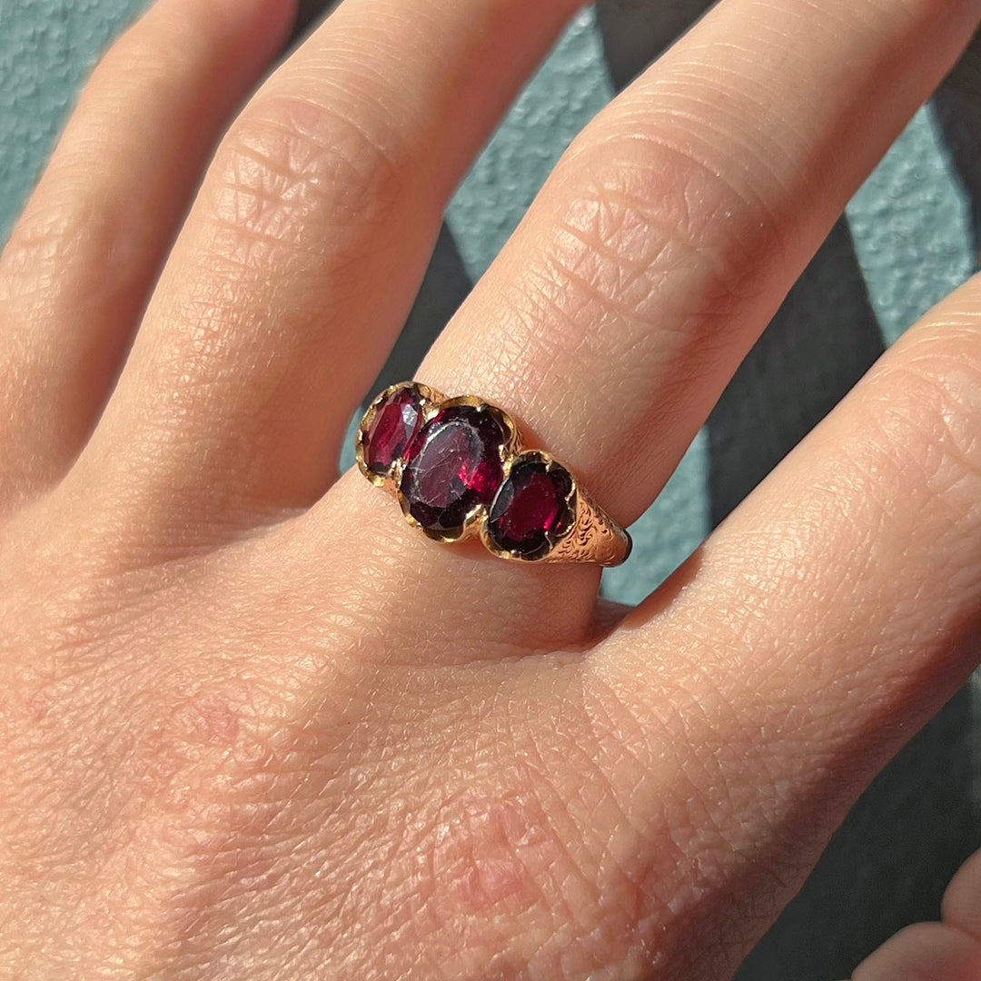 Elegant vintage garnet ring in warm gold