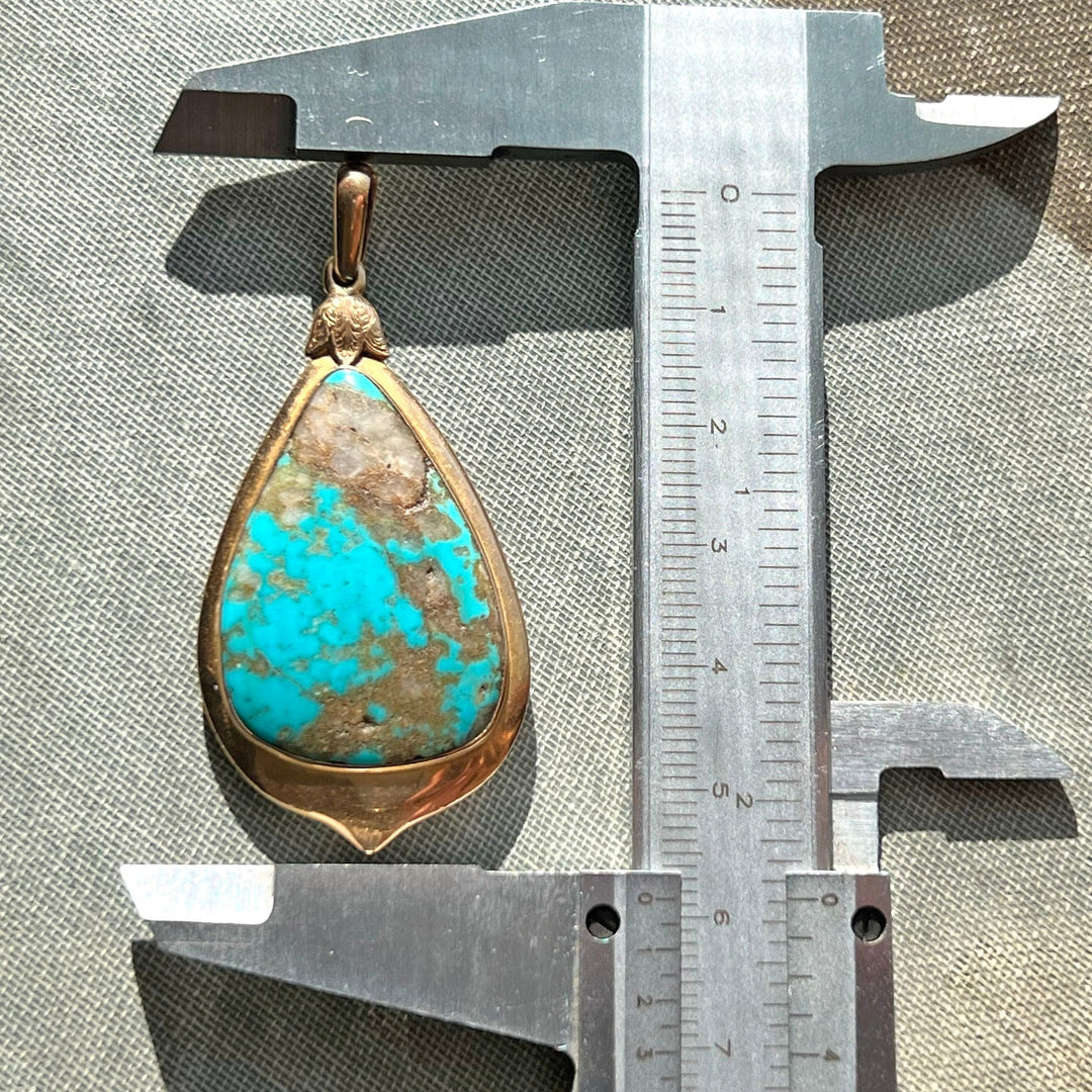 Detailed view of turquoise set in gold