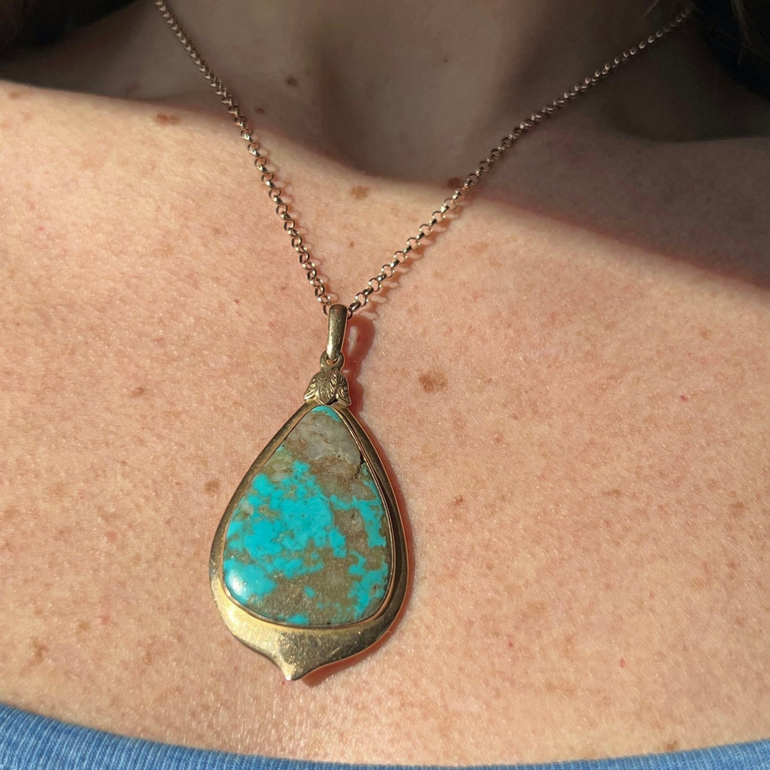 Close view of large turquoise cabochon pendant
