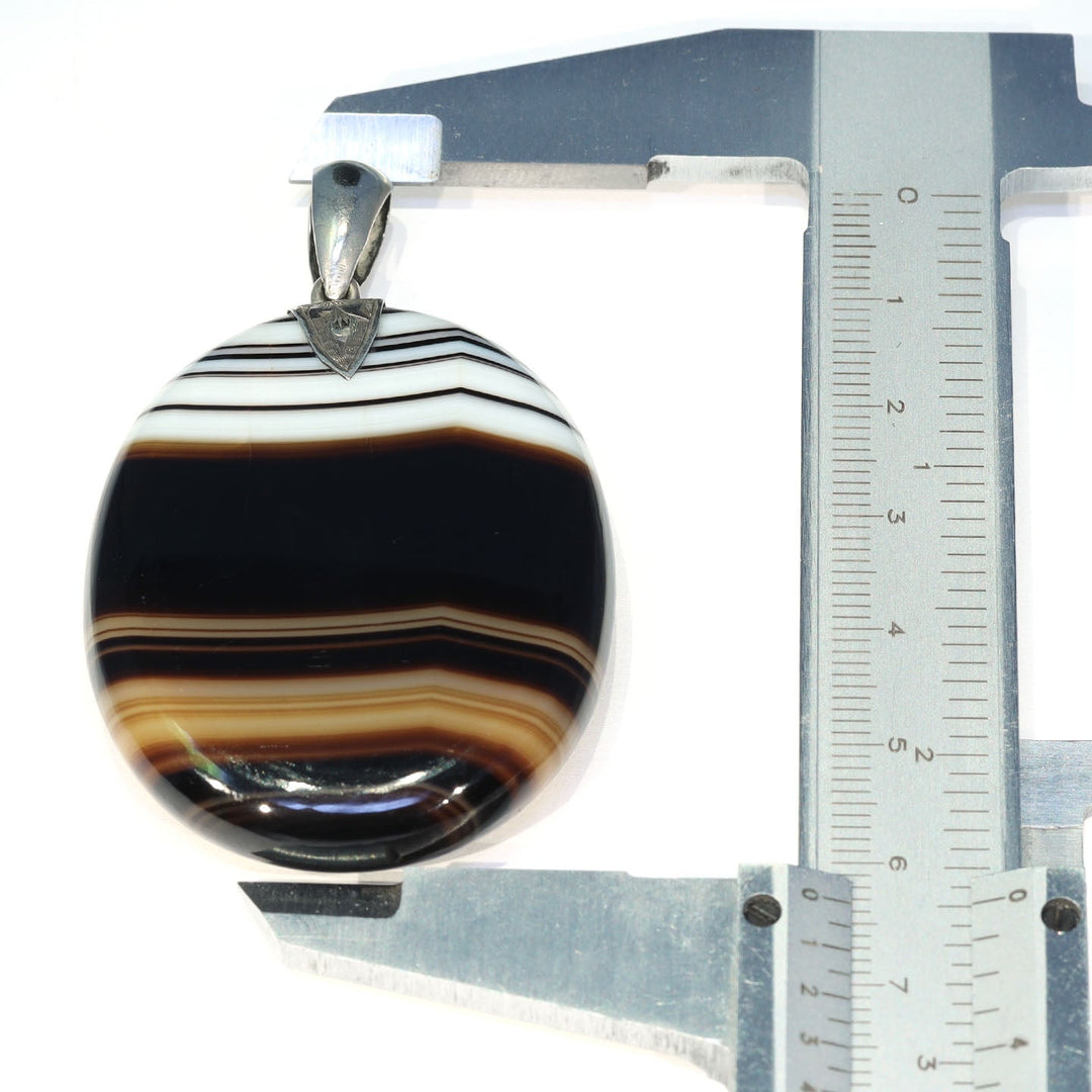 Victorian natural stone pendant measuring 63.5 millimeters long