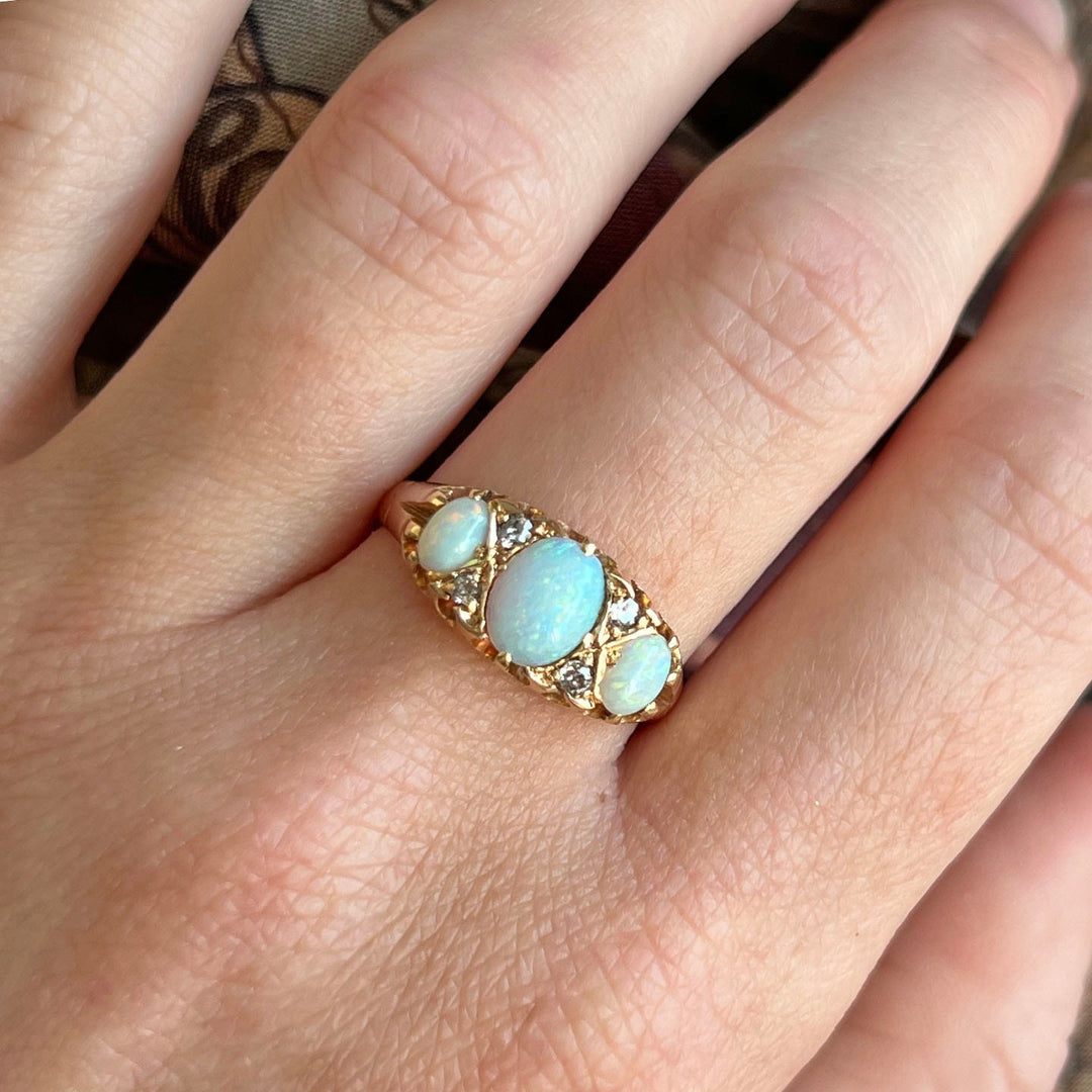 Victorian opal diamond ring worn on hand antique design