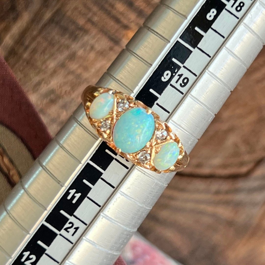 Close up opal with fire and old cut diamonds Victorian ring
