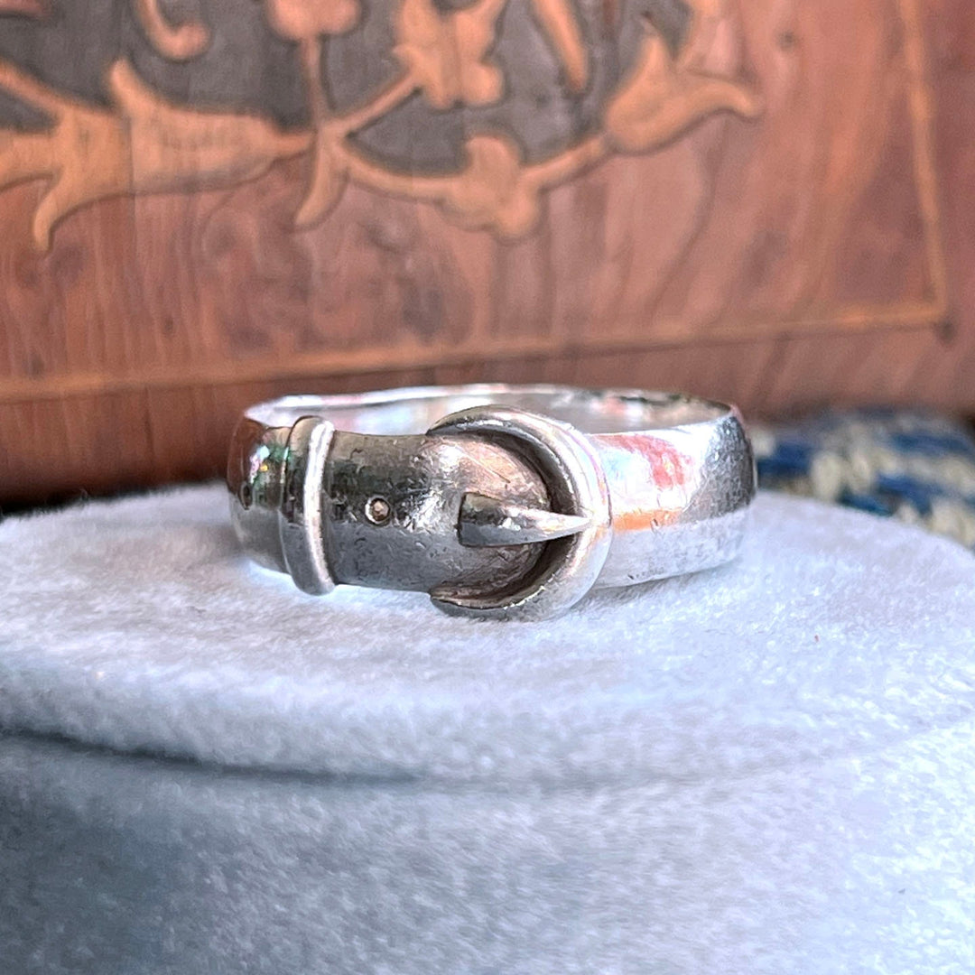 Close view of engraved silver buckle ring
