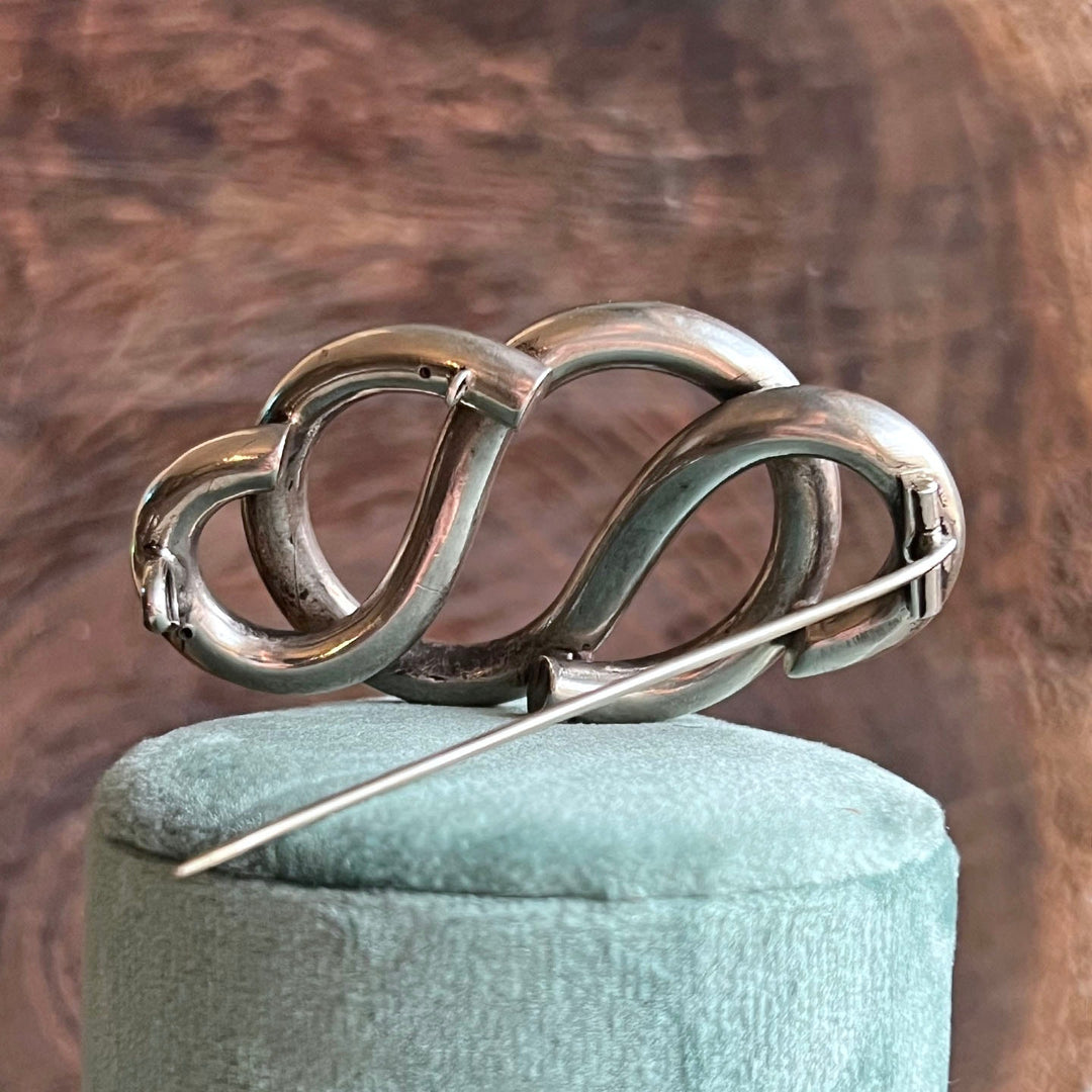 Elegant vintage silver love knot brooch