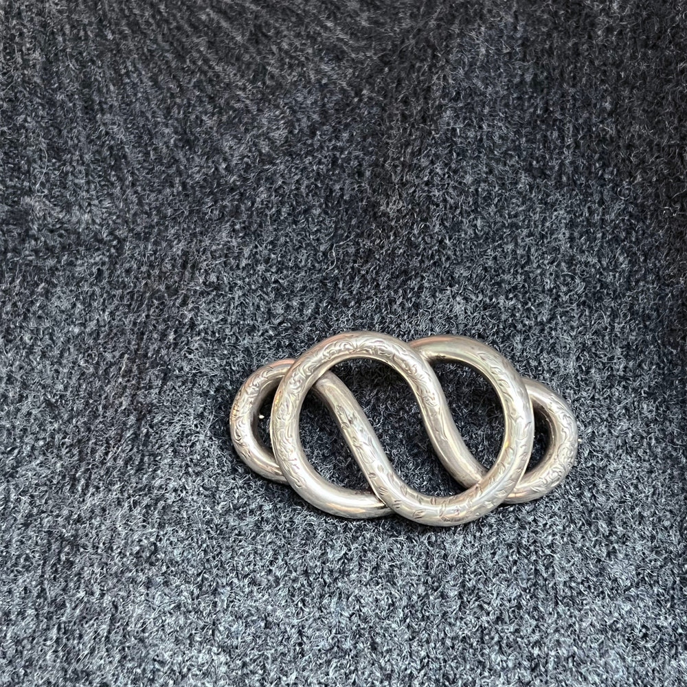 Victorian silver brooch romantic knot design