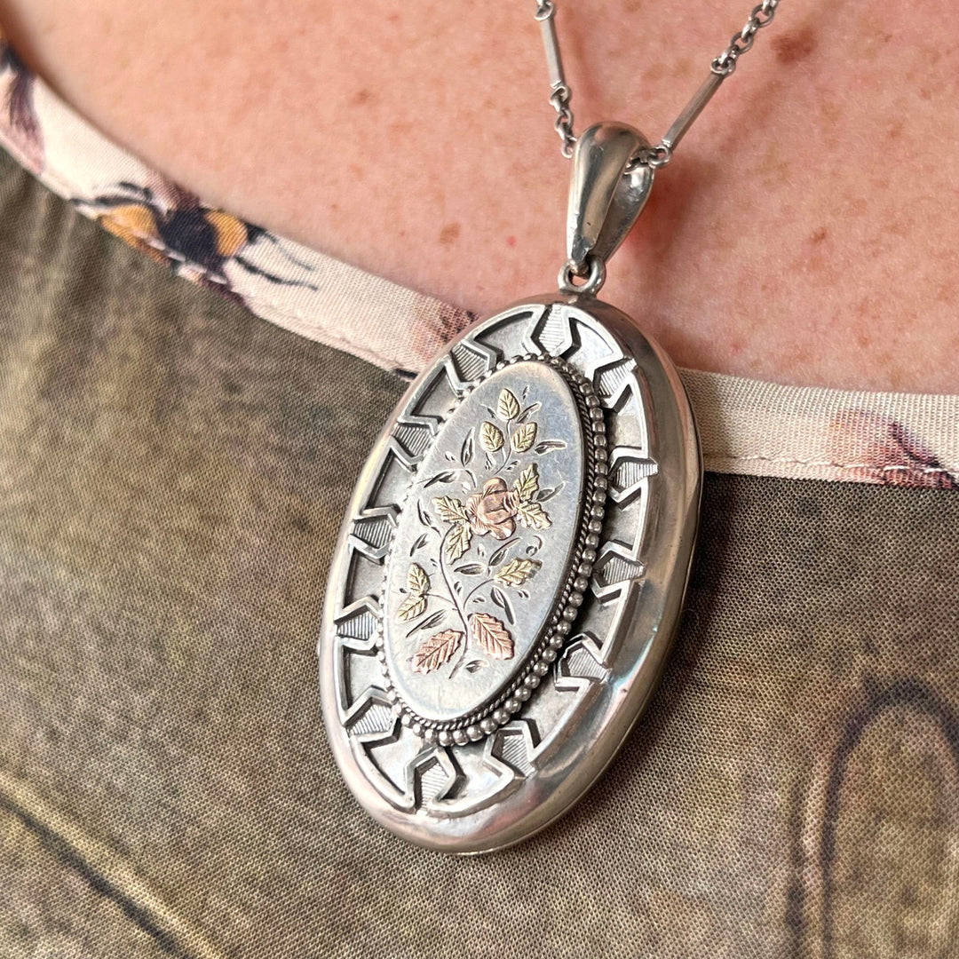Victorian silver locket worn on chain antique style
