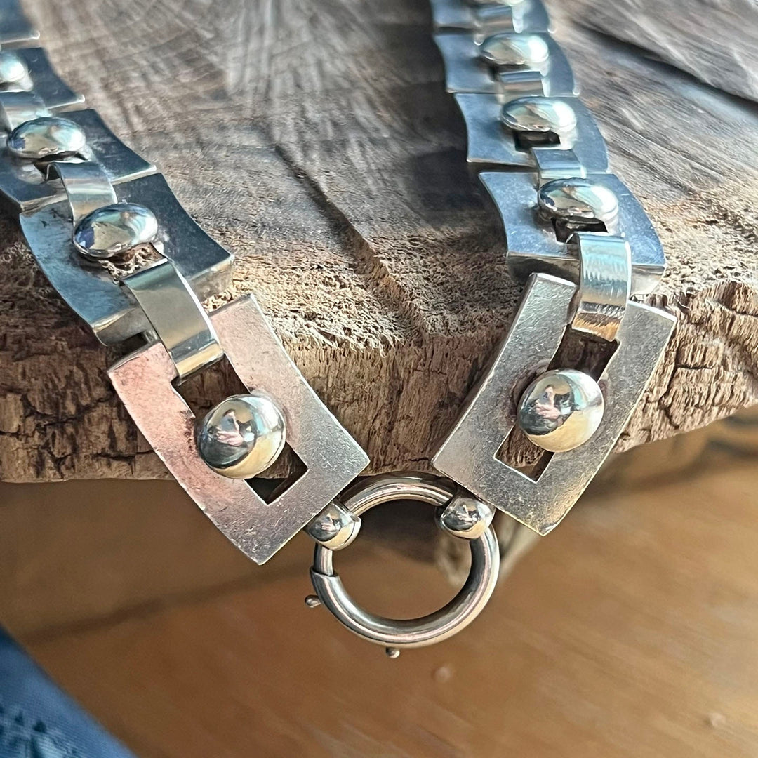 Close view of bold silver collar links