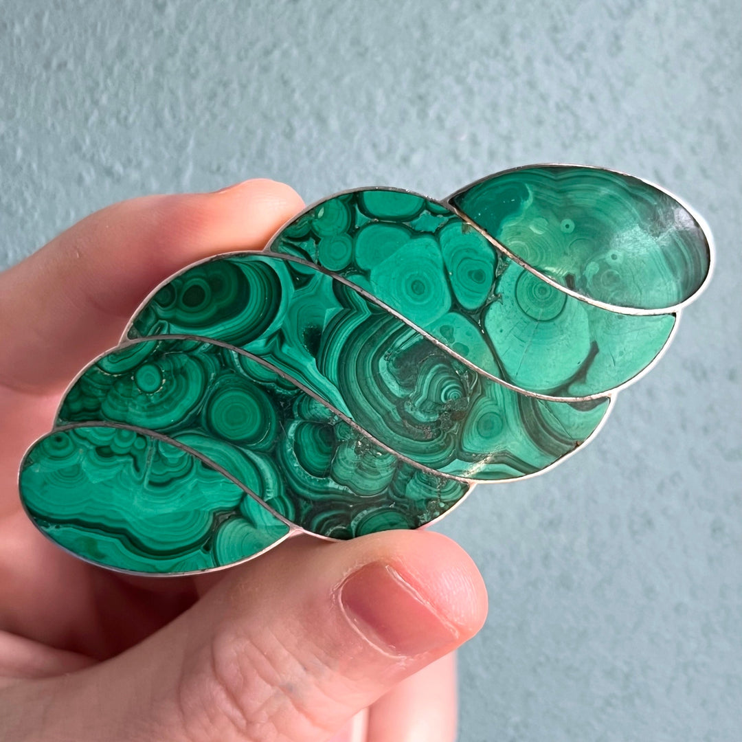Close view of rich green malachite inlay