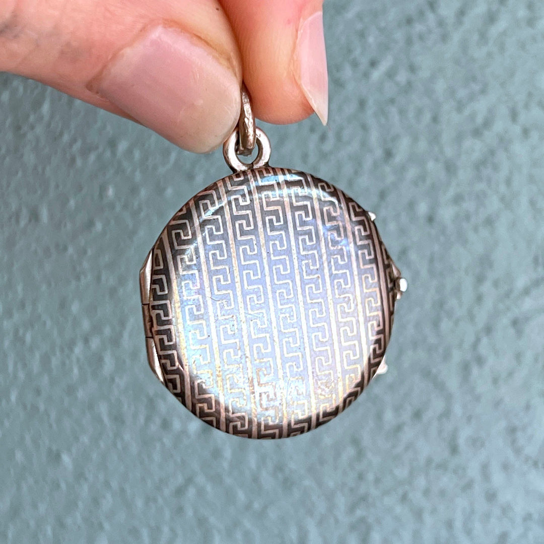 Elegant antique silver botanical locket