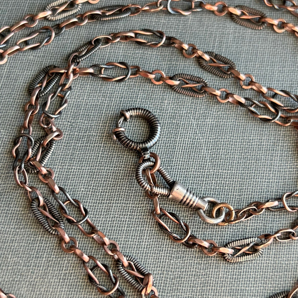 Close view of black niello silver links