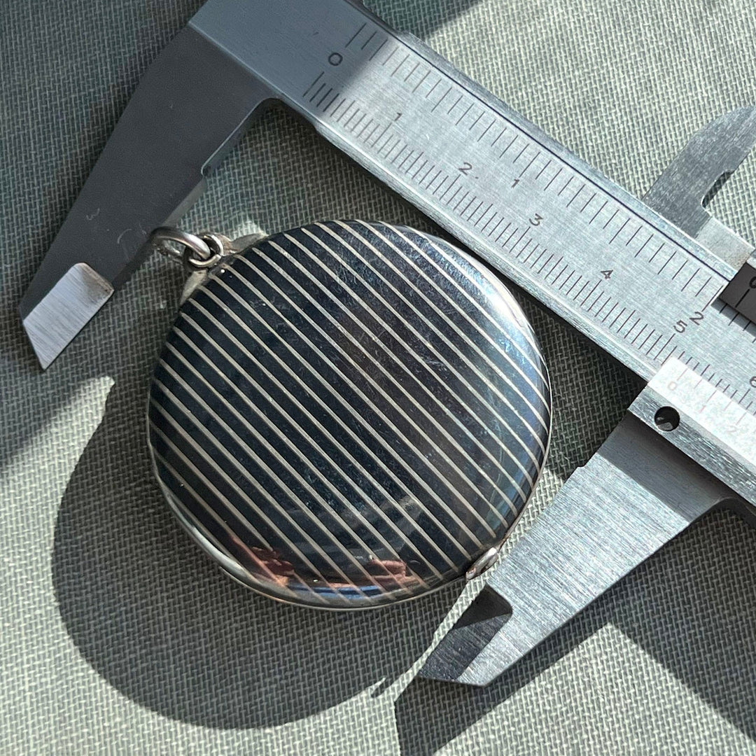 Antique silver locket with black inlay work