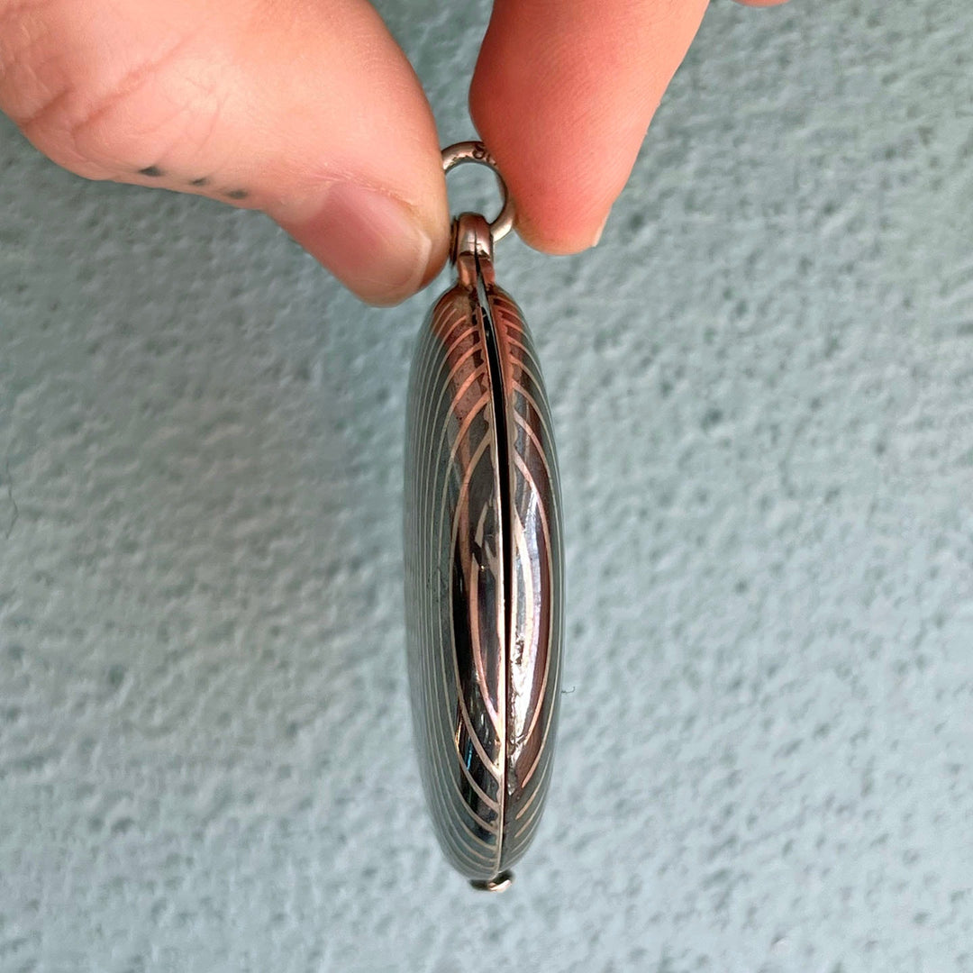 Side profile of Victorian niello locket