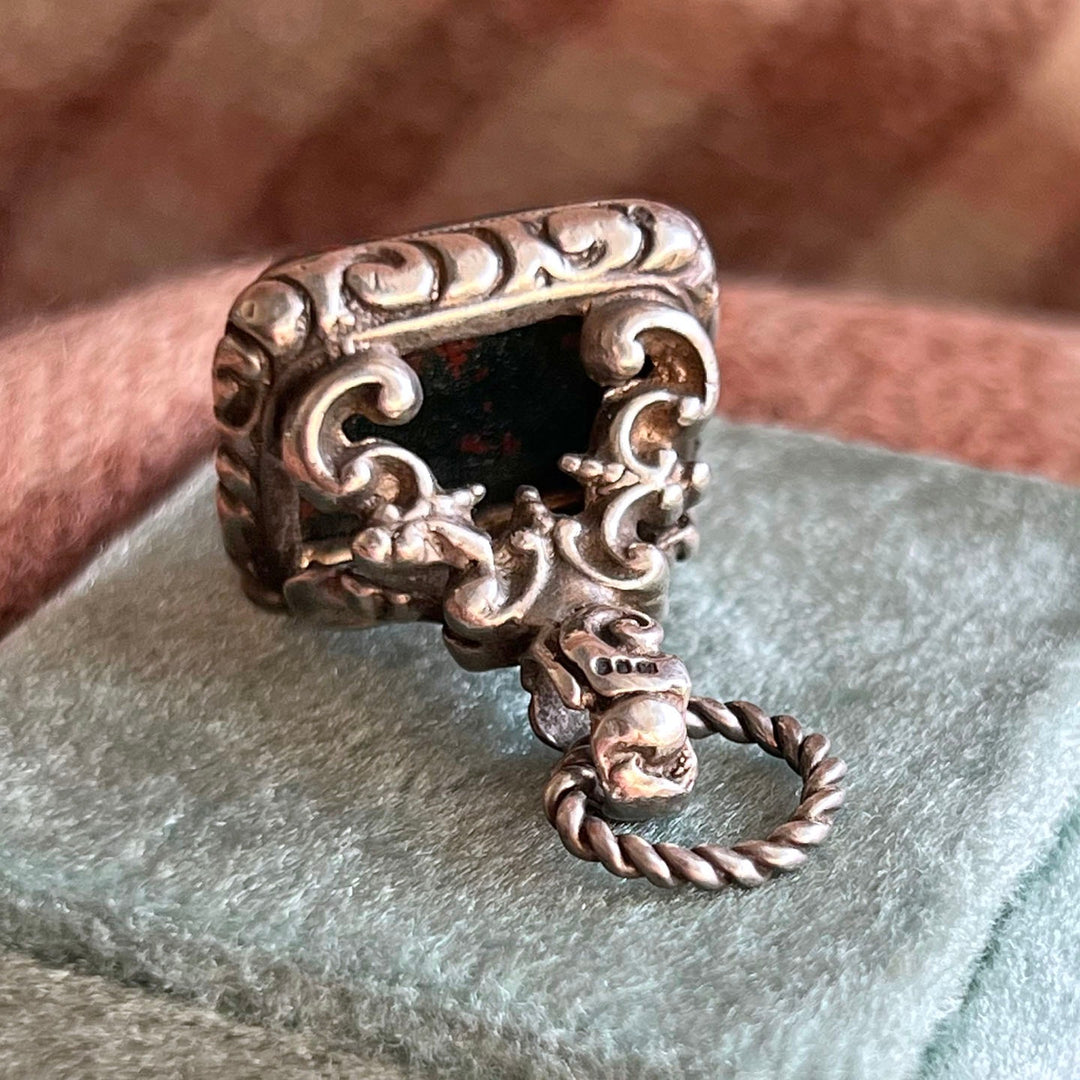 Detail of engraved silver fob setting with bloodstone