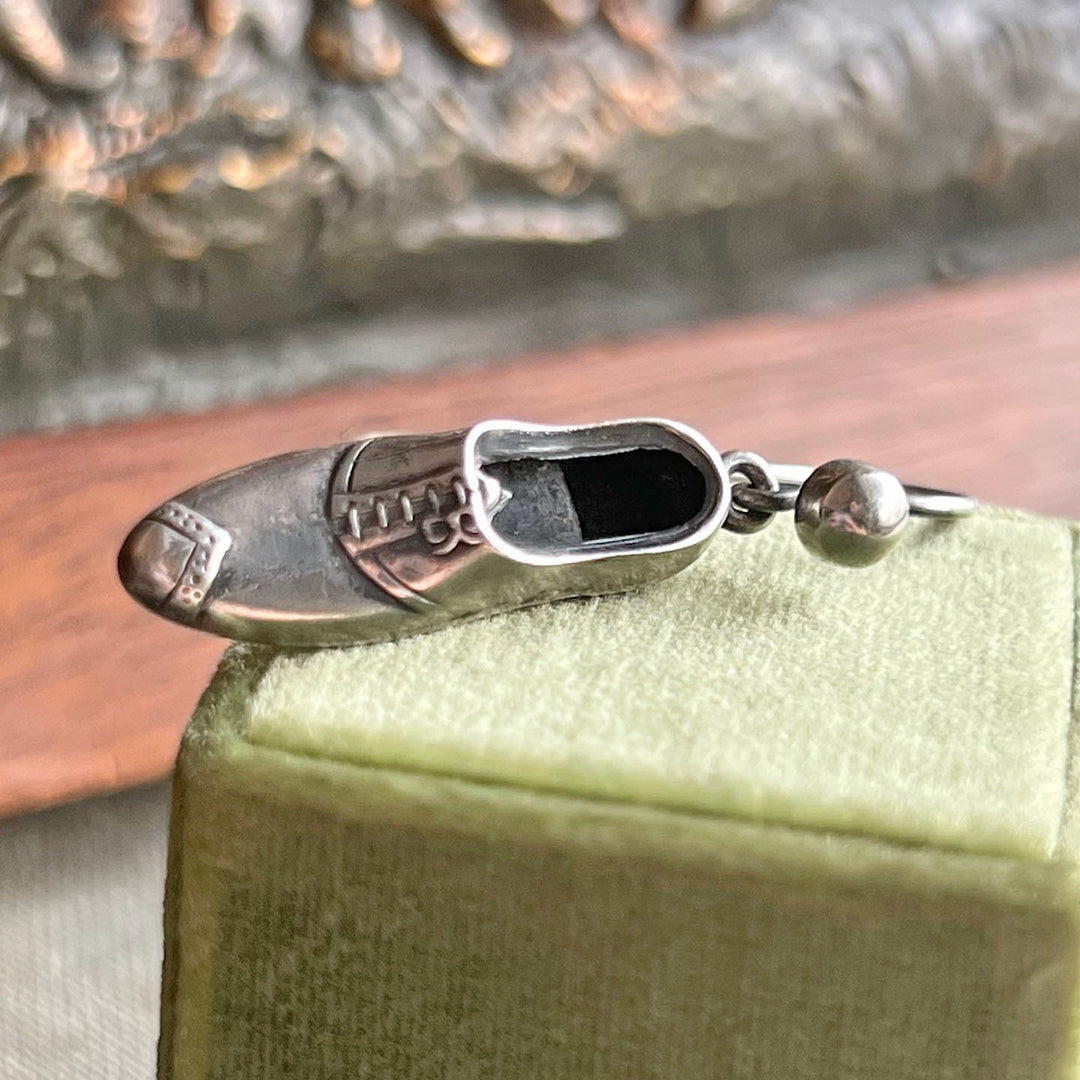 Close view of novelty shoe earrings