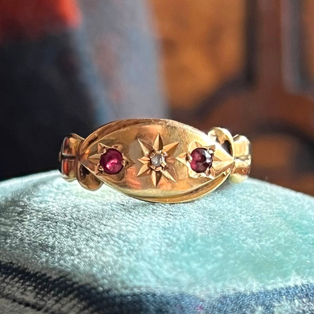 Antique Victorian ruby and diamond starburst ring gold three stone design