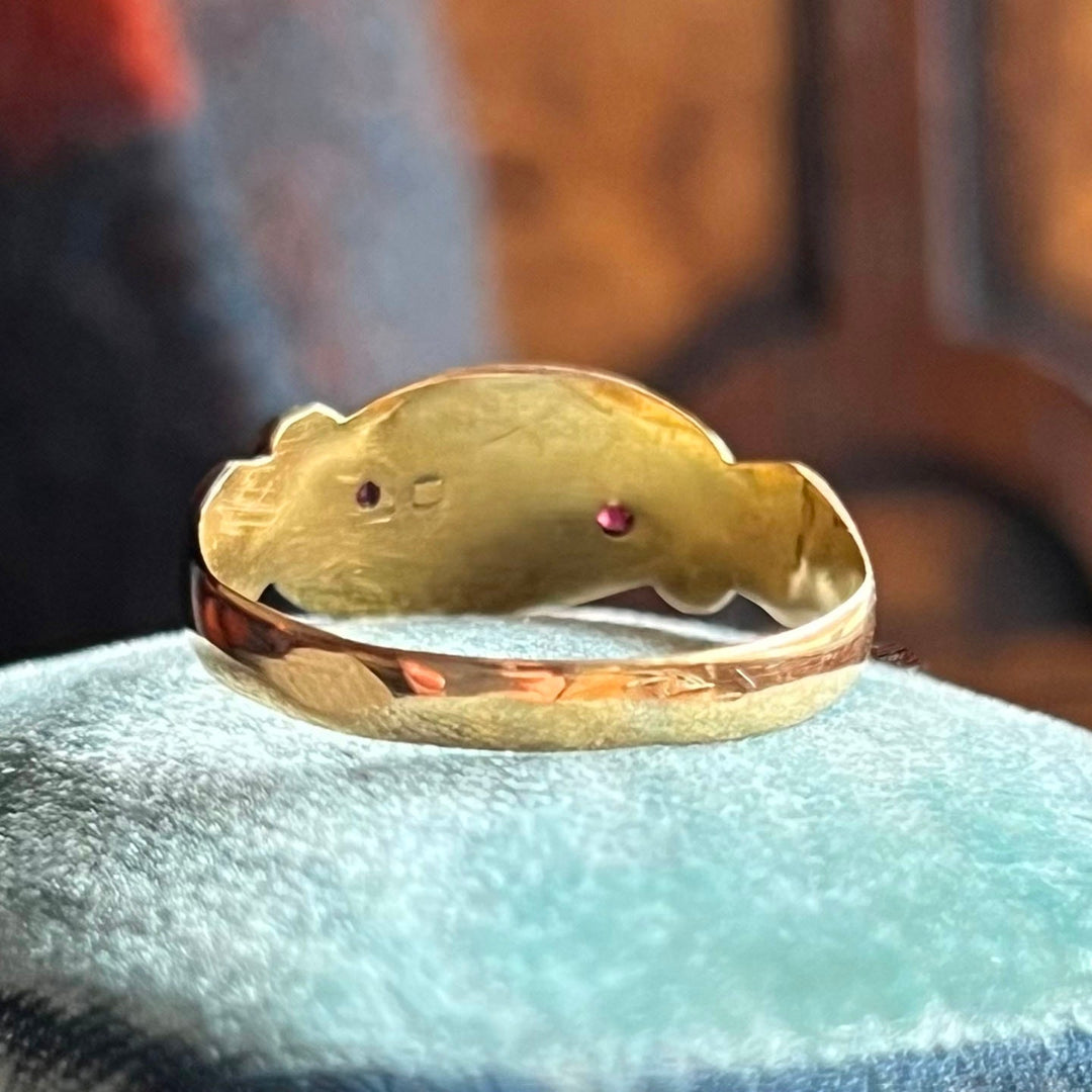 Close up ruby and diamond starburst setting Victorian ring