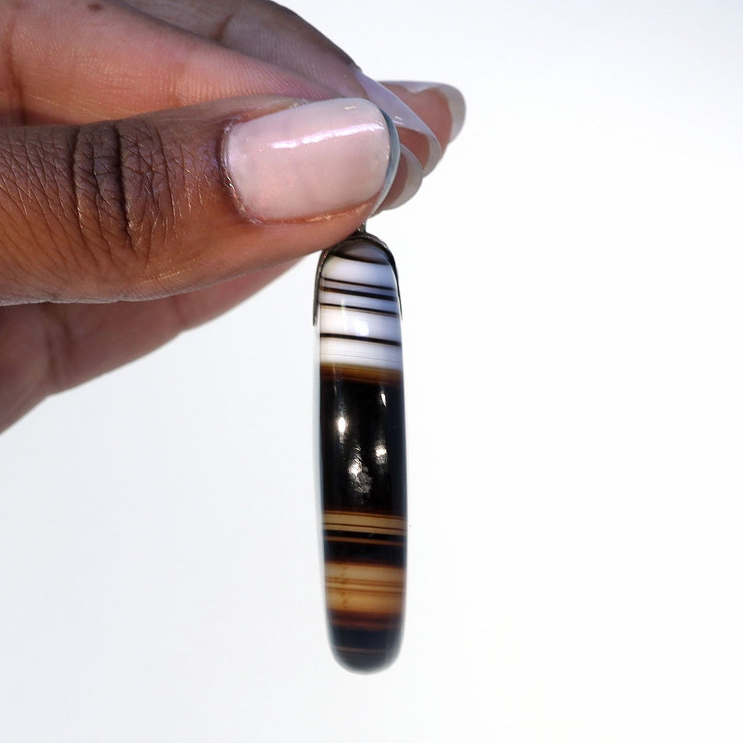 Victorian natural stone pendant measuring 63.5 millimeters long