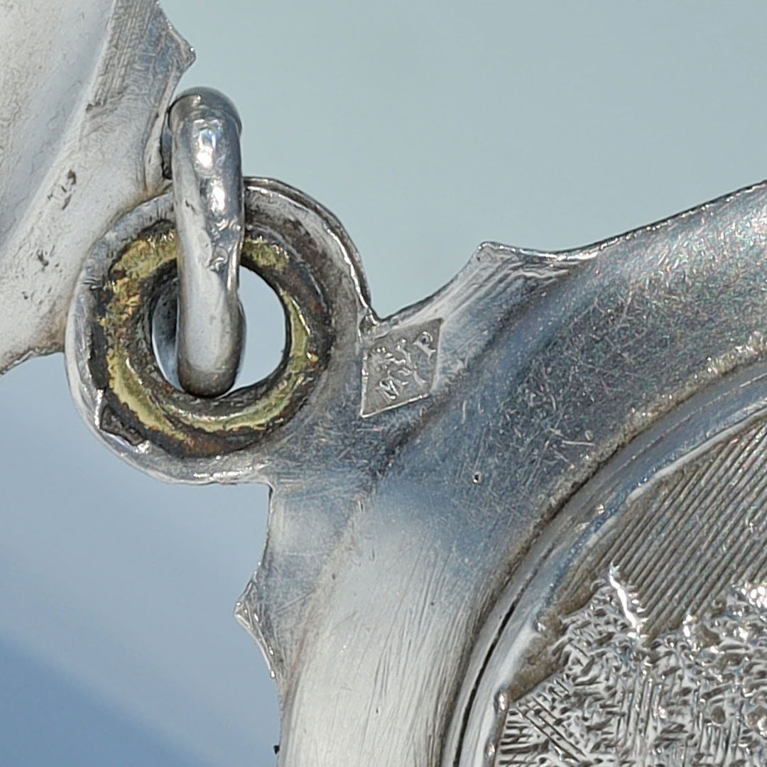 Collectible French silver slide locket with figural design