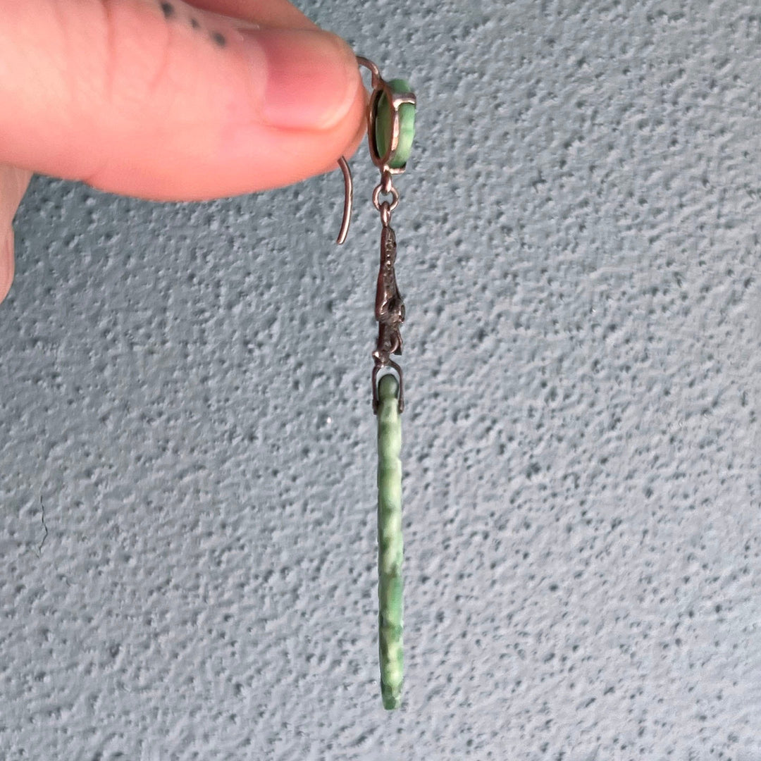 Side profile of jade drop earrings