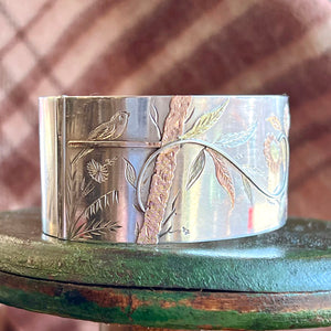 Antique Victorian Silver Aesthetic Bangle with Bird and Floral Motif, c. 1880