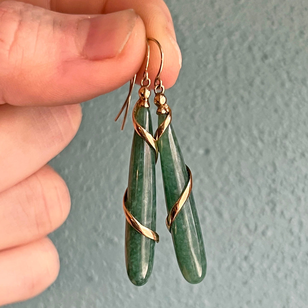 Close view of carved jade drop earrings