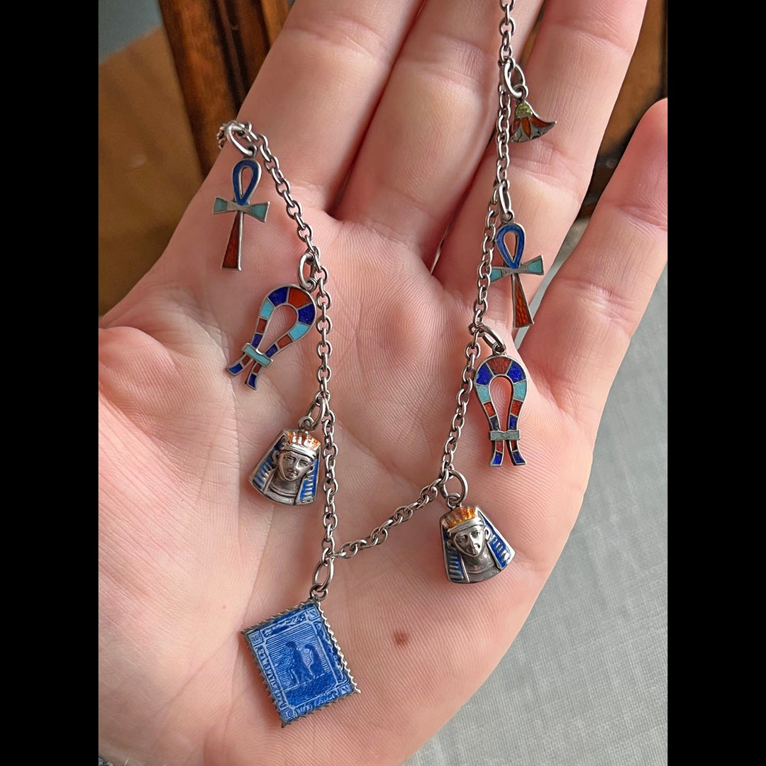 Detailed view of silver and enamel charms