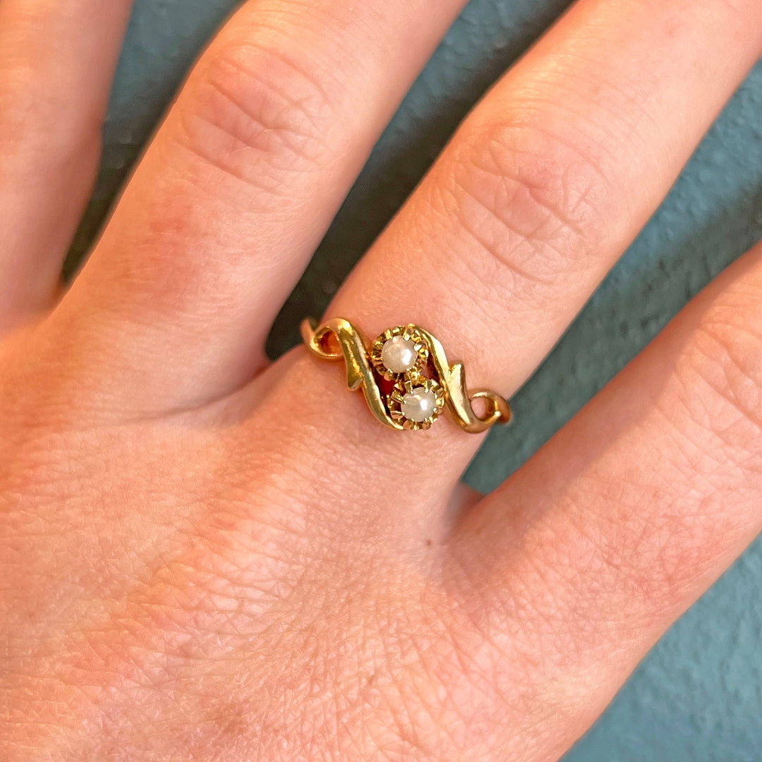 Close view of pearl bypass ring in gold